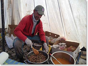 Mehmet prepares a delicious meal while we are adjusting our crampons. We will eat an early dinner so that we can go to bed early to rest. Tomorrow morning we will wake up at 12:30am and we will try to be climbing by 2:00am.