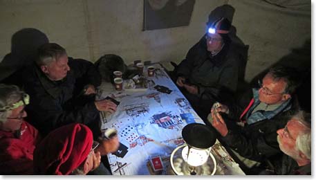 Team enjoying a game of bridge in the dinning tent