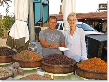 Kelley who is planning to open a Health Food Store talking with the local vendor.