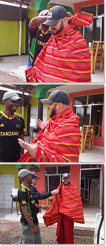 While the team gears up Jason gets a lesson on dressing as a Maasai.