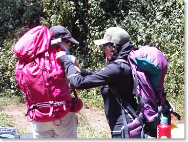 The girls help each other prepare for Kilimanjaro.