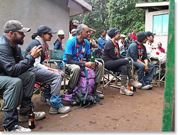 The team gathers together to enjoy the entertainment.