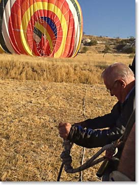 Doc (Charles) helps land the balloon