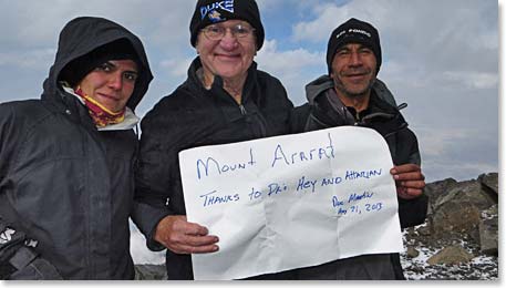 Charles at his high point of the day 15,200 feet. He is holding a sign thanking his surgeons who made climbing to 15,200 feet possible for Charles. A very proud moment for him!