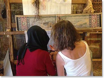 After dinner we visited a carpet factory. Within moments of when we arrived Carolyn was sitting with the girls learning the knots.