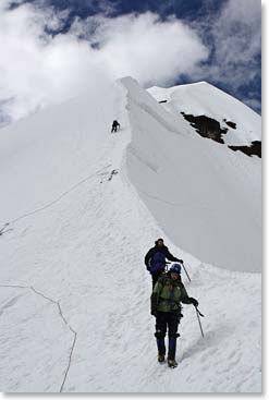 Here we see the team on their descent, with the view of the summit to look back on.