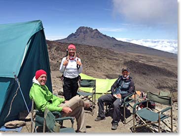 Lunch at 15,300 feet. We are at Barafu Camp for a lunch break. After lunch we will climb to our own high camp at 16,000 feet. We have a fantastic view of the second volcano of Kilimanjaro, Mwenzi, to the east. Mwenzi’s jagged spires reach to nearly 17,000 feet.