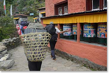 Travellers spin prayer wheels in a clockwise direction to send prayers for merit, blessing and good fortune.