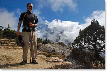 Scot on the trail with the peak named Tamserku behind