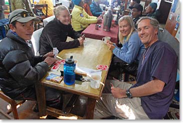 High altitude pastimes, playing cards with Jyeta in the lodge.