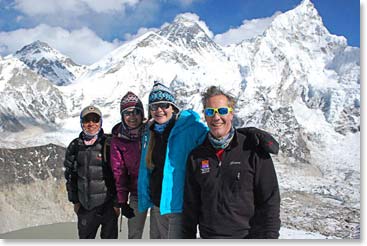 The team stands proudly with Jyeta, Mount Everest behind.