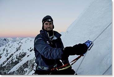 In the cold first light of dawn, Scot climbs the fixed lines toward the summit ridge of Island Peak.