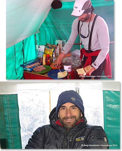 Simon turner re-fuels and warms up in our dinning tent