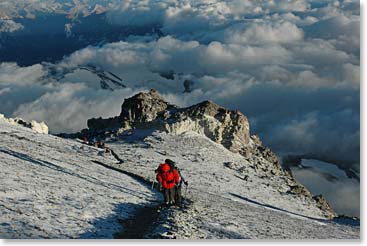 Climbing above the clouds in the early morning light