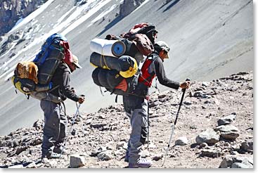 Our superhuman Bolivian team carrying heavy loads all the way down to Plaza de Mulas today. They are amazing!