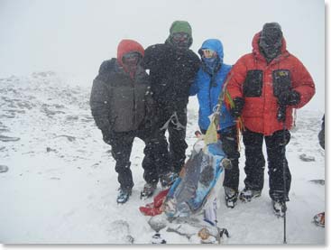 The team braves the weather on the summit of Aconcagua. Congratulations team!
