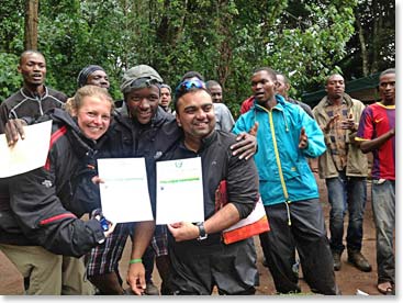 Sheila and Bharath hold up their Summit Certificates. Way to go team!