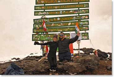 Happy teammates on the top of Kilimanjaro!