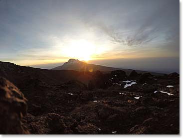 A perfect end to our Kili climb- watching the sun set over Tanzania