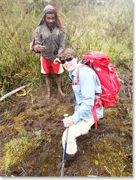 Jen trekking through the mud in her rain boots