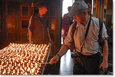 Dave lighting butter lamps in a monastery at Swayambhu