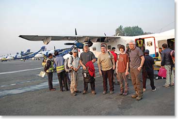 The team prepares to board the plane in Kathmandu.