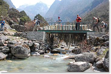Crossing a bridge over the Bhote Kosi river