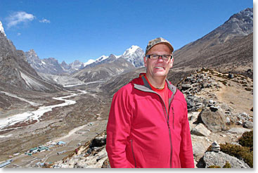 Jim Allen posing for a photo on top of the hill