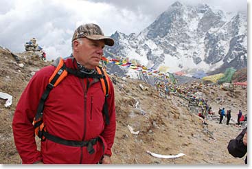 Jim Allen on Dukla hill with memorials in the background