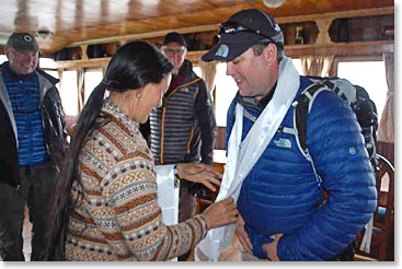 Ryan receives a silk blessing scarf called a “Khata” from Yangzing