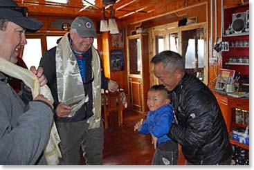 Paljor, who lives at the Panorama Lodge in Namche offers Jackson a Khata blessing scarf.