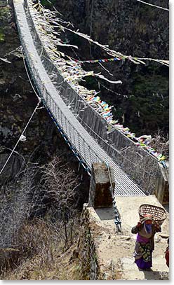 Crossing a suspension bridge from Namche to Phakding