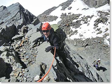 Micheline climbing along fixed rope