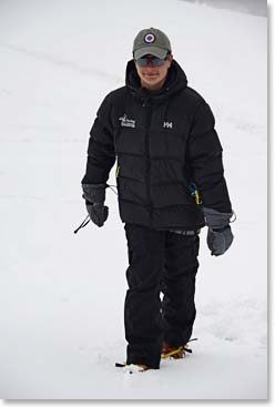 Tom checking out his crampons 