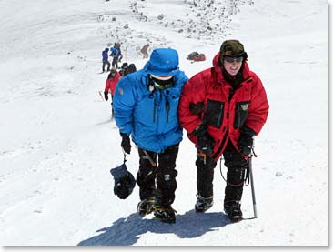 Karina and Micheline walked to the summit arm and arm, just at 12:00 P.M.