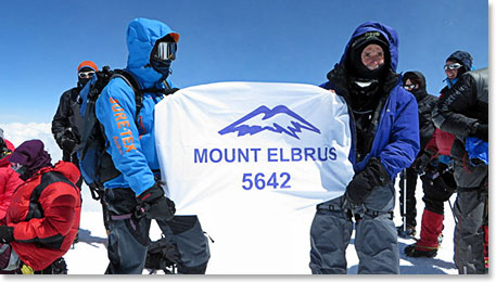 It was Leslie’s idea to have our banner made. Karina got it printed in Nalchik and Alec and Leslie proudly displayed in on the summit.
