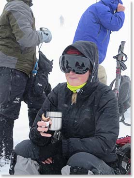 Johanna enjoys a snack and hot tea to refuel on our acclimatization hike.