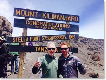 Father and son Jonathan and Jordan at Stella Point 18,800ft