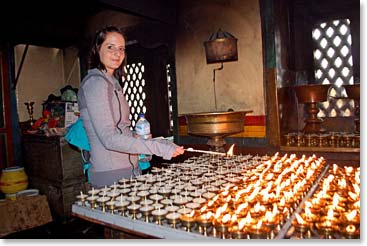Bonnie lighting butter lamps at Swayambhunath