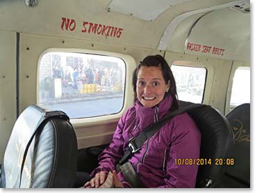 Bonnie sitting comfortably on their private plane arranged by Berg Adventures 