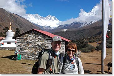 Scott and Barb in Tangboche, with Everest and Lhotse visible in the distance