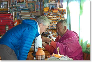 Scott blessed by Lama Geshi.