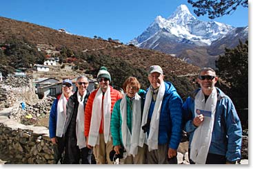 The team wearing their white Khata blessing scarves outside Lama Geshi’s house, Ama Dablam is beautiful.