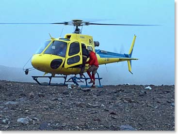 Gord boards the helicopter.