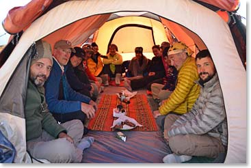 The team inside the tent waiting for dinner