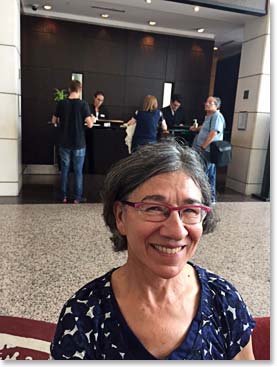 Dena smiling in the lobby