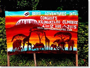 A banner welcoming the climbers down from the mountain