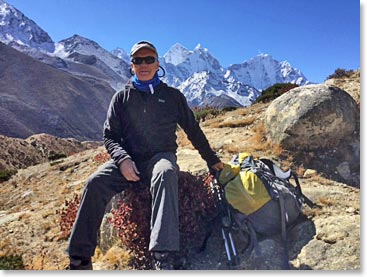 Chuck takes a break on our hike with Kangtega behind