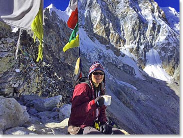 Leah enjoying a hot cup of tea at the summit