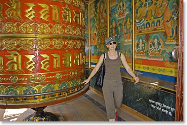 Johanna spinning a prayer wheel at Boudhanath